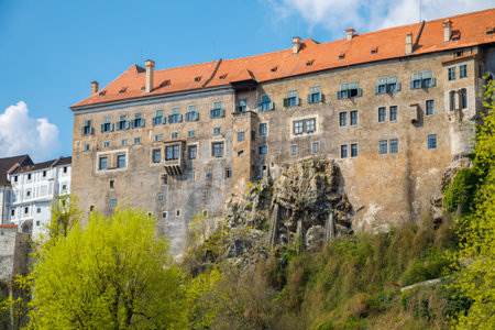 Majestic cesky krumlov castle in czech republic, a unesco world heritage site, standing tall on a cliff overlooking the vltava riverの写真素材