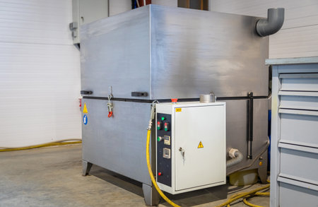 Powerful industrial washing machine ensuring thorough cleaning in a bustling manufacturing workshop, optimizing production processesの写真素材