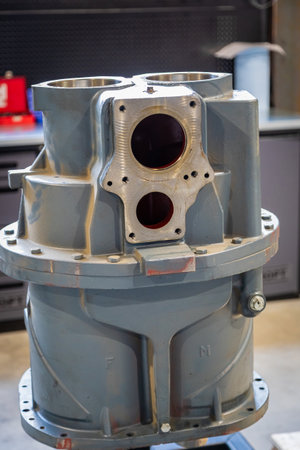 Close up of a screw compressor block undergoing maintenance in a mechanical workshop, showcasing industrial repair processesの写真素材