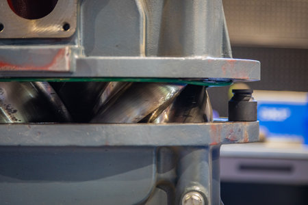 Close up view of the internal mechanism of a screw compressor, highlighting the precision engineering and intermeshing rotors that compress air or gasの写真素材