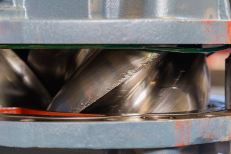 Close up of a roots blower rotor spinning, generating pressure for various industrial processesの写真素材