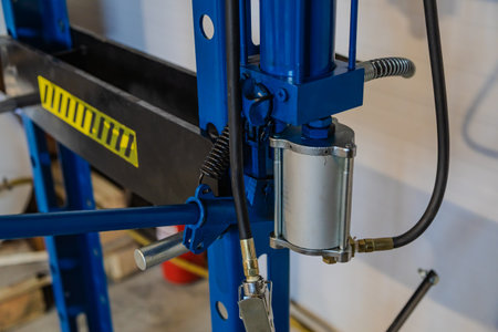 Close up of a hydraulic press, highlighting its key components, ready for operation in a professional workshop environmentの写真素材