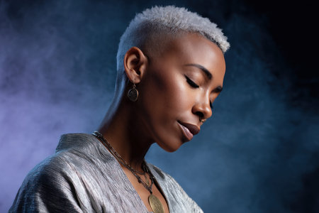 Portrait of an African American woman with silver hair, wearing a shimmering top, set against a soft incense haze, evoking tranquility and eleganceの素材