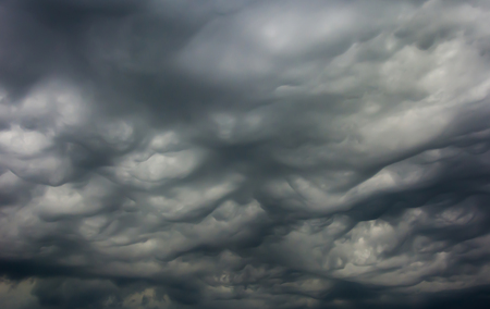 Dark and dramatic storm clouds on the sky, backgroundの写真素材