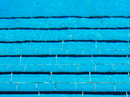 Top view of pool steps under transparent ripped waterの写真素材