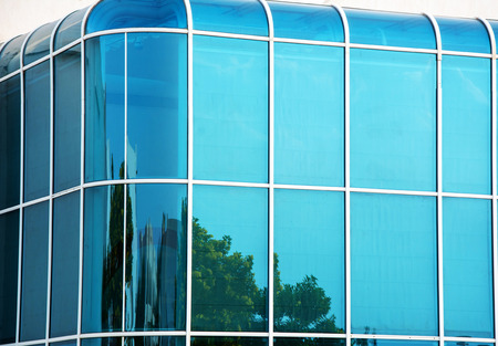 Glass wall of modern building with rounded corners