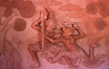 Scene of battle on the wall in Red Temple (Wat Sila Ngu) on koh Samui islandの写真素材