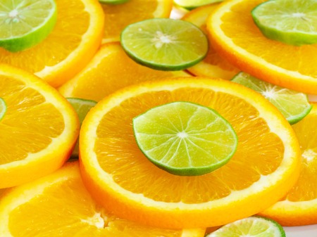 citrus slices, oranges and limes. Fruits backdrop. Healthy eating, vitamins and veggie concept