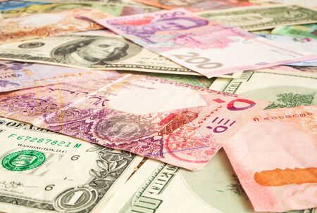 Cash money from various countries (Dollar, Qatari riyal, hryvnia). Exchange business concept...