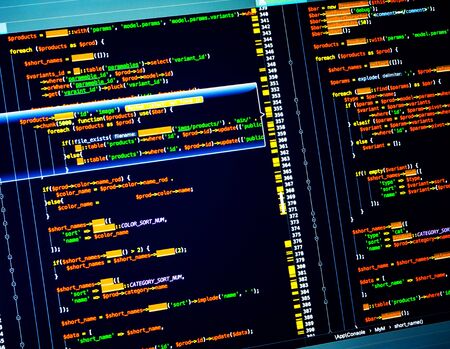 Colorful php code on dark blue background in code editor, closeup, Site web developing