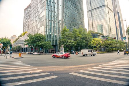Intersection with cars and crosswalks in downtown Shenzhen, China - April 2018