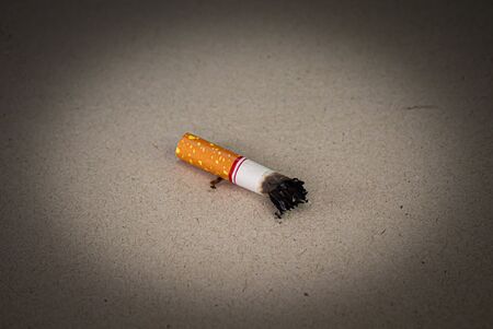 World No Tobacco Day; Smoking cigarettes and laying them on the floor with space for text.の写真素材