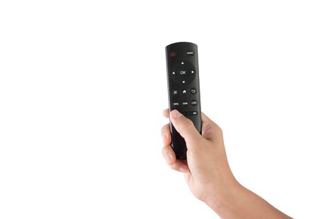 Close-up hand holding remote control isolated on white background.の写真素材