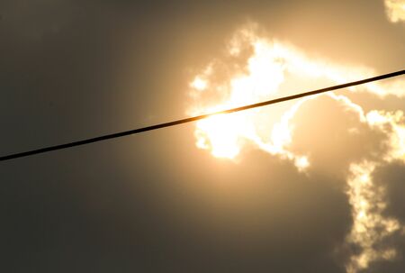 Cables of electric on sunset sky background in evening.の写真素材
