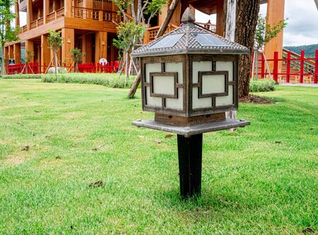 Wooden Lamps with lighting from solar panel in the garden of Hinoki land; Japanese building style for travel in Chaiprakarn district Chiang Mai,Thailand.の写真素材