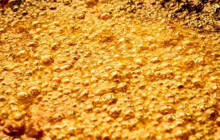 Close-up of hot oil in pan from top view.の写真素材