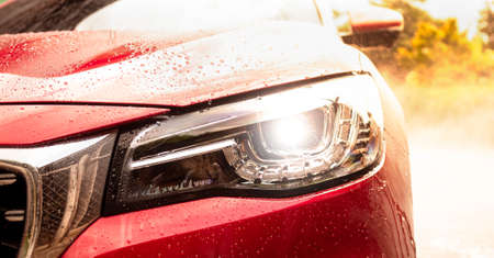 Close-up of front headlight lamp of modern car.の写真素材