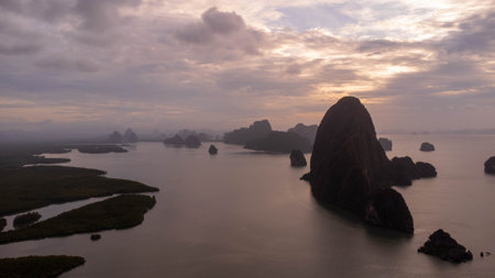 Aerial view of Samet Nangshe and mangrove forest at sunset in Phang Nga Bay in the Andaman Sea,...