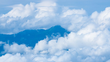 Aerial view of beautiful sky with clouds and sun on a summer day. Time lapse of clouds above the blue sky with the sun shining. Sky nature background.の写真素材