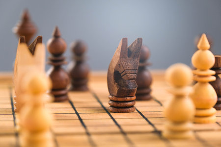 Close-up of businessman hands playing chess game. Concept of business strategy and tactic.の写真素材