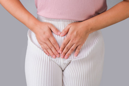 Woman with hands on her crotch isolated on white background. Female hand holding her crotch with pelvic pain or vaginal itching. gynecological problems. Health hygiene conceptの写真素材