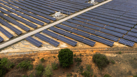 Top view on photovoltaic solar power panels. Drone aerial view of Solar panels system power generators from sun. Alternative Energy Sources - The Concept of Sustainable Resources.の写真素材