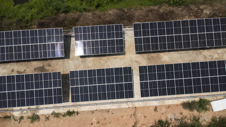 Top view on photovoltaic solar power panels. Drone aerial view of solar panels with water pumps,...