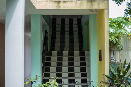 Long black and white tiled staircase in the building. building entrance stairsの写真素材