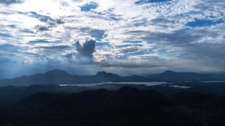 Green mountains and beautiful clouds under blue sky. Beautiful mountain landscape with bright sky.の写真素材