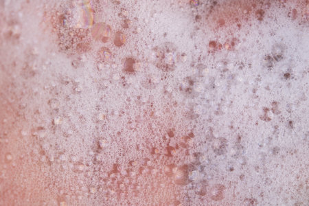 Texture of white soap foam with abstract soap bubbles background.の写真素材