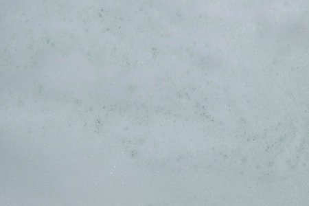 Texture of white soap foam with abstract soap bubbles background.の写真素材
