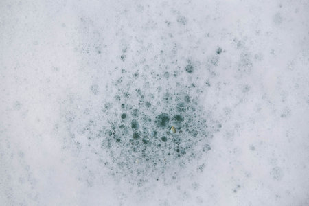 Texture of white soap foam with abstract soap bubbles background.の写真素材