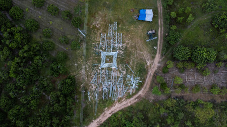 Architectural metal structures of frame base connection with rivets and reinforced metal structures. Assemble and install Steel Tower for power transmission lines for sustainable power development.の写真素材