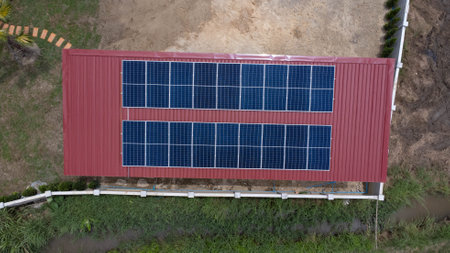 Aerial view of the solar panels on the roof. Photovoltaic panels on the roof. Renewable clean green energy.の写真素材