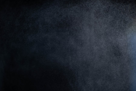Water spray dust on dark background. Spraying mist effect isolated on black background.