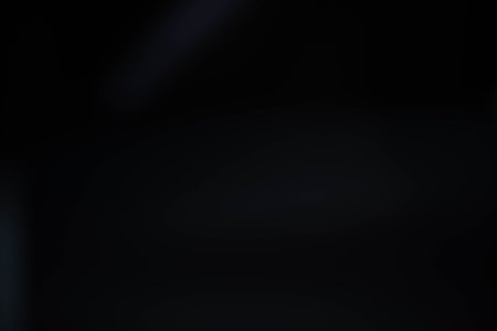 Water spray dust on dark background. Spraying mist effect isolated on black background.の写真素材