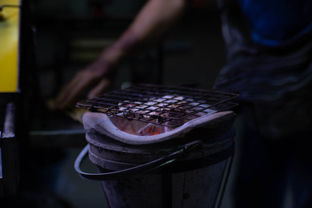 Dried squid grilled over traditional charcoal stove. Famous street food menu in Asia.の写真素材