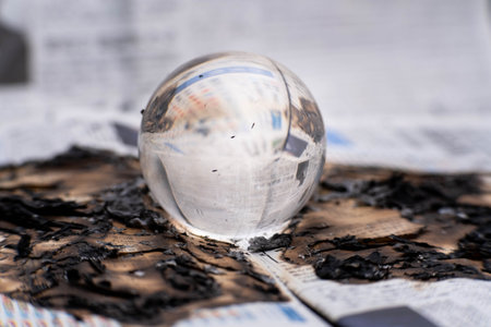 Glass globe on fire. Planet Earth Burning. Global Warming and Climate Change Concept.の写真素材