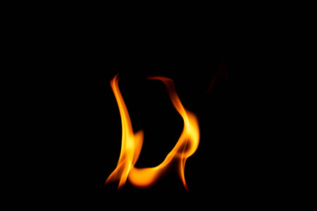 Hot flames on a black background. Beautiful flame of fire in the dark. Abstract of burning flames and smoke.の写真素材