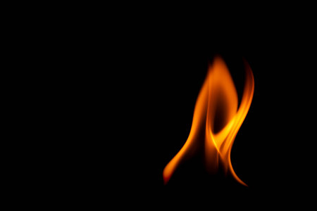 Hot flames on a black background. Beautiful flame of fire in the dark. Abstract of burning flames and smoke.の写真素材