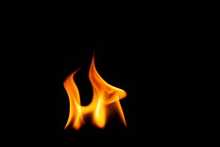 Hot flames on a black background. Beautiful flame of fire in the dark. Abstract of burning flames and smoke.の写真素材