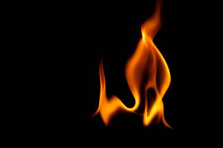 Hot flames on a black background. Beautiful flame of fire in the dark. Abstract of burning flames and smoke.の写真素材