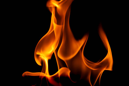 Hot flames on a black background. Beautiful flame of fire in the dark. Abstract of burning flames and smoke.の写真素材