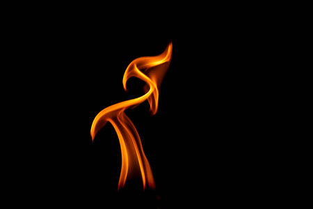 Hot flames on a black background. Beautiful flame of fire in the dark. Abstract of burning flames and smoke.の写真素材