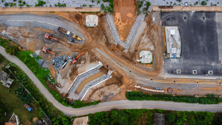 Aerial view of a cement bridge under construction. Road currently under construction at several levels to increase trafficの写真素材