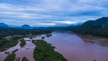 Aerial view of the mighty Mekong River meandering in the morning during the rainy season against the...