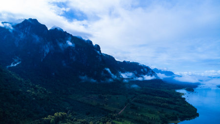 Beautiful view of mountains with fog in Kanchanaburi, Thailandの写真素材