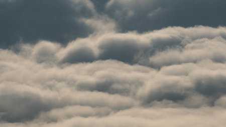Time lapse of flowing fog waves over mountains. Amazing nature background of beautiful ocean of clouds in the morning.の写真素材