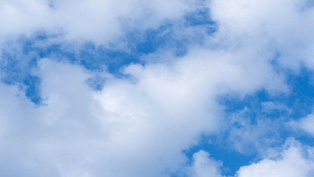 Time lapse of cumulus clouds moving in a blue sky. Beautiful blue sky with soft white clouds time lapse for abstract background.の写真素材