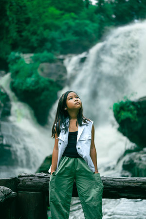 Happy girl enjoying nature and celebrating success and outdoor life in nature near beautiful...